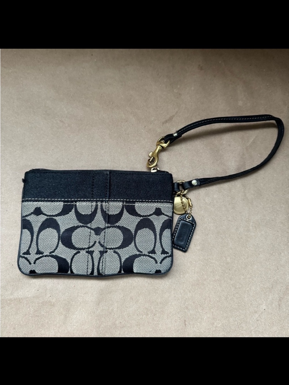 Coach Black and Grey Signature Monogram Small Wristlet. 6โ by 4โ